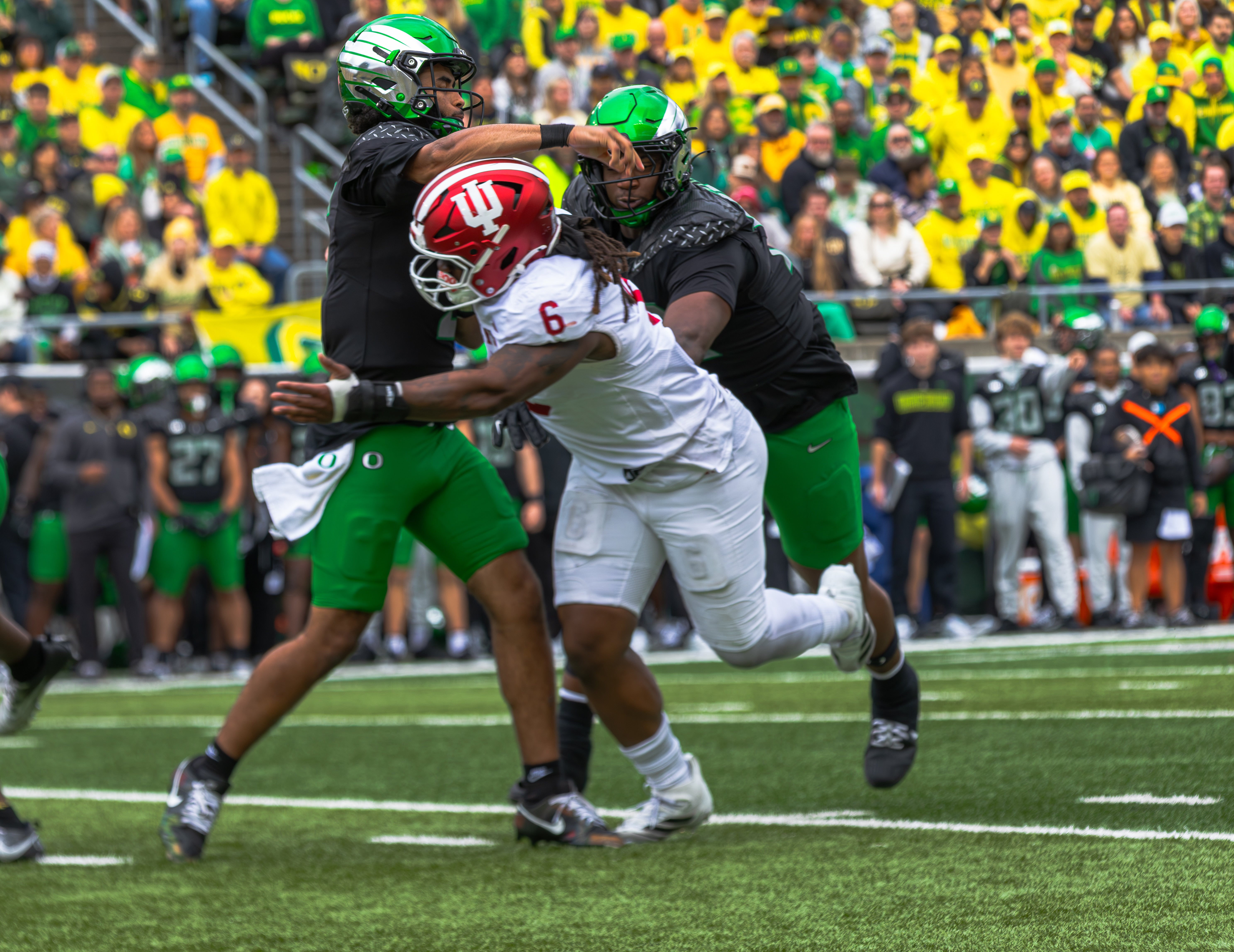 Oregon Quarterback Dante Moore battles through a physical matchup vs. Indiana 