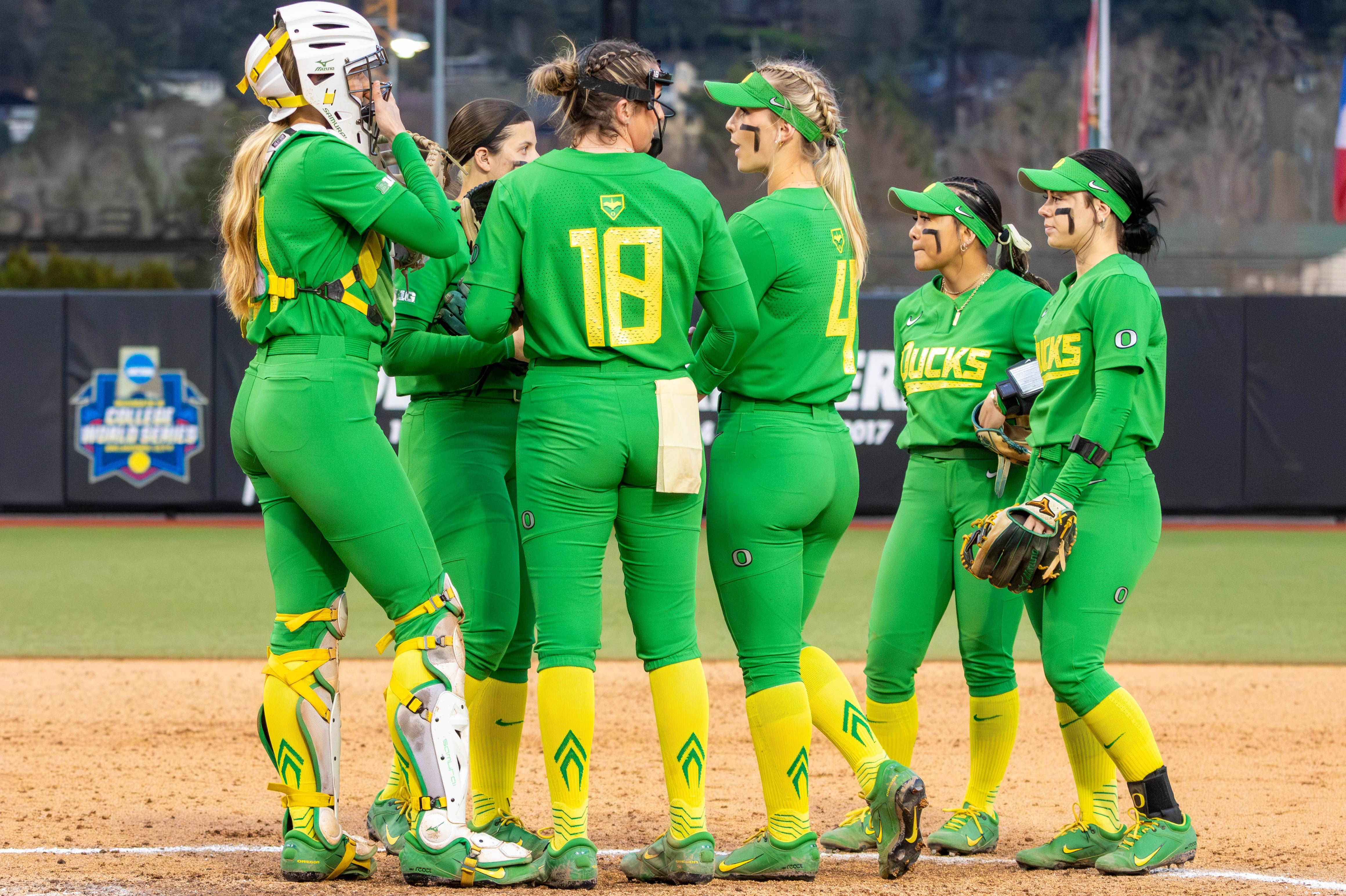 The Oregon Ducks meet in the circle during their March game at the Jane Sanders Classic