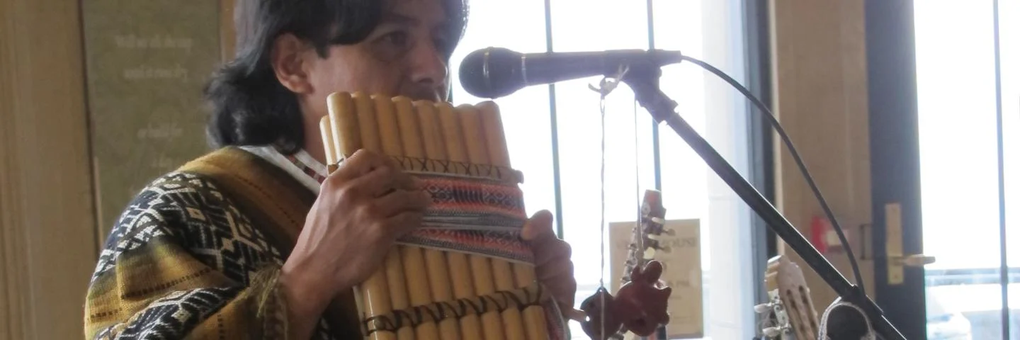 Alex Llumiquinga performing on a pan flute.