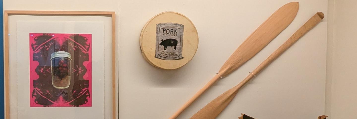 An exhibit case with art by Shirod Younker