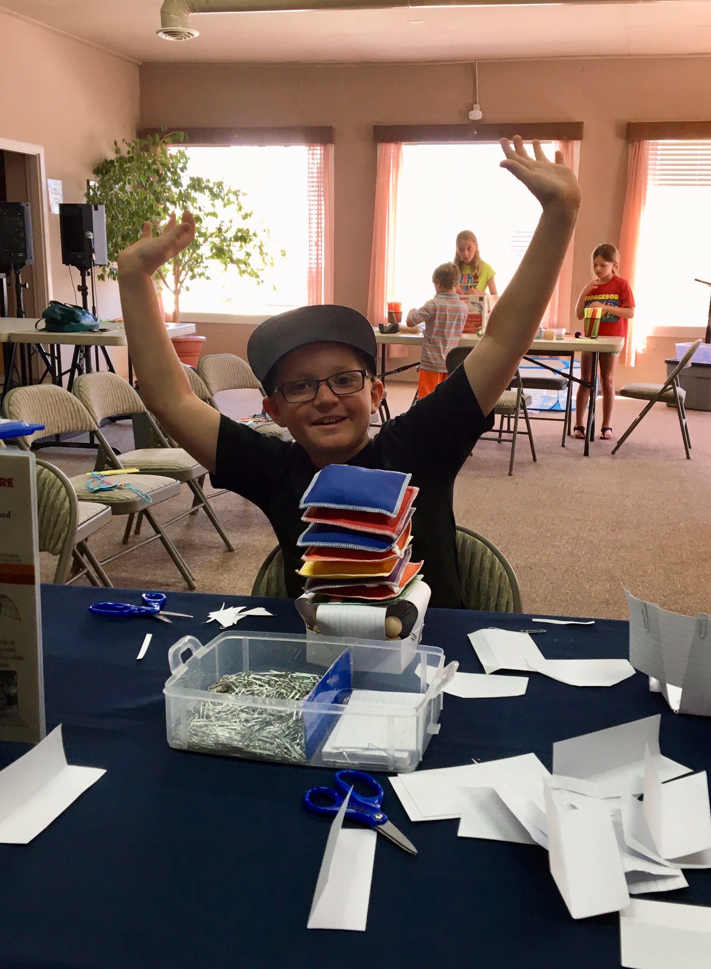 Child completing the shelter-building challenge