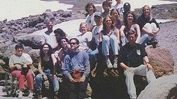 group of people on rocks