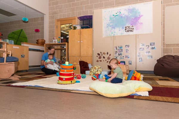 Room offers soft mats and play spaces and toys for infants.