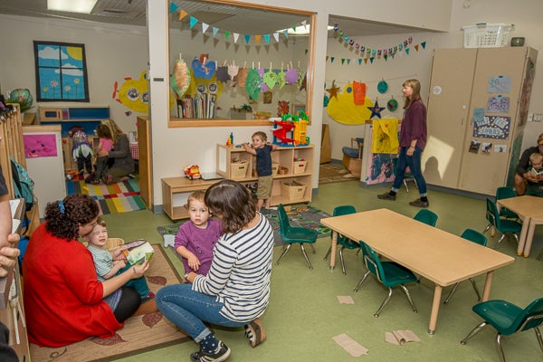 Classroom space for toddlers offering group table spaces, and sever play activity spaces.