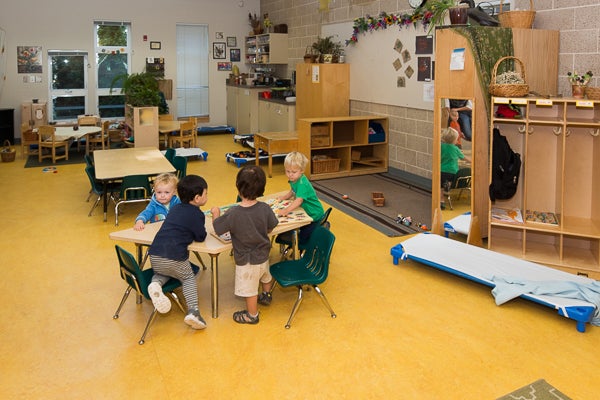 Classroom space offers group seating tables, toys and soft play areas.