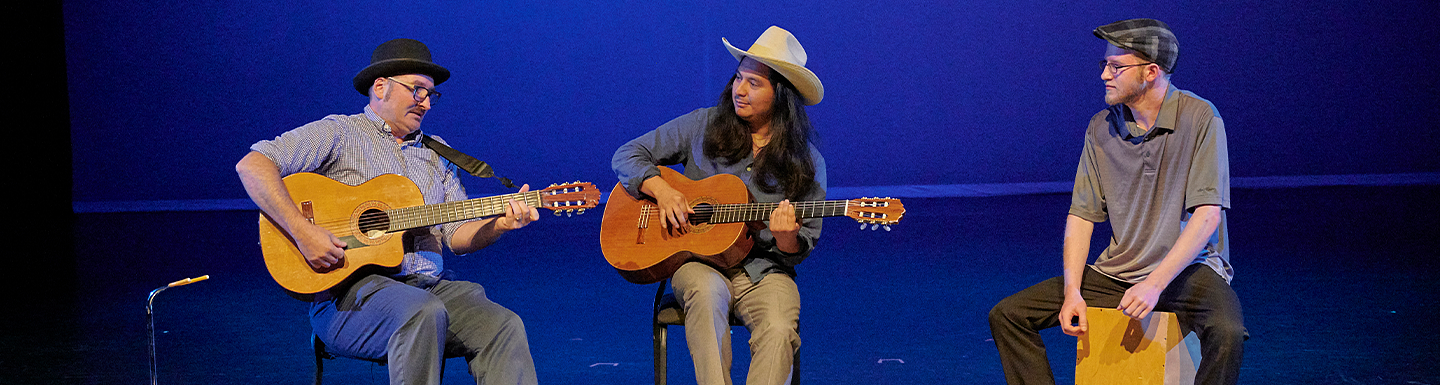 trio of performers on guitar and drums