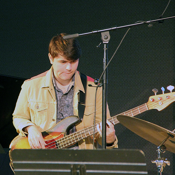 student performing guitar