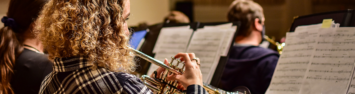 side view of trumpet student playing