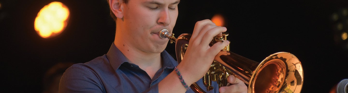 Trumpet student playing their instrument