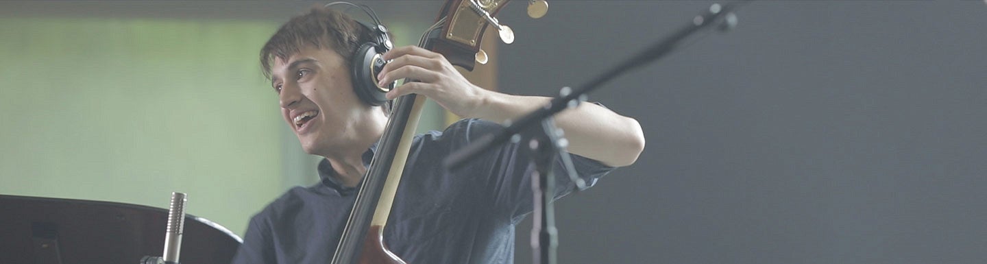 Bass student in recording studio