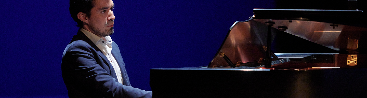 male pianist playing