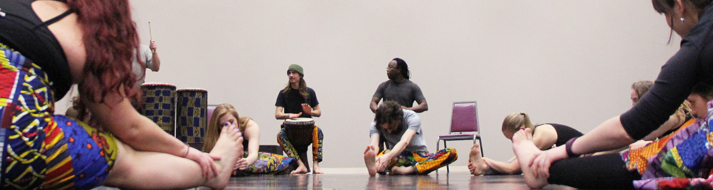students stretch for a cultural dance class