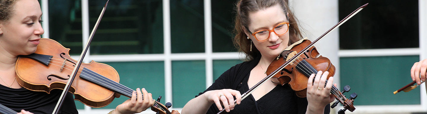 group of female violinist playing
