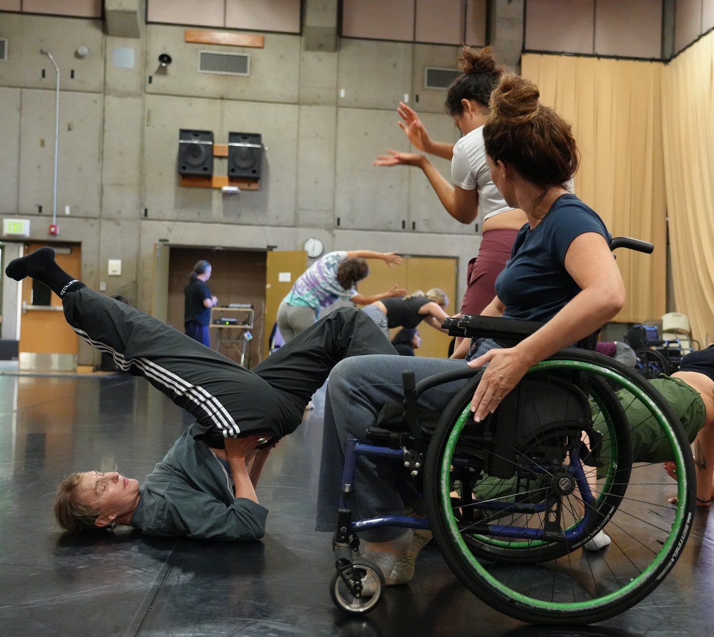 dancer in wheelchair and another on the floor