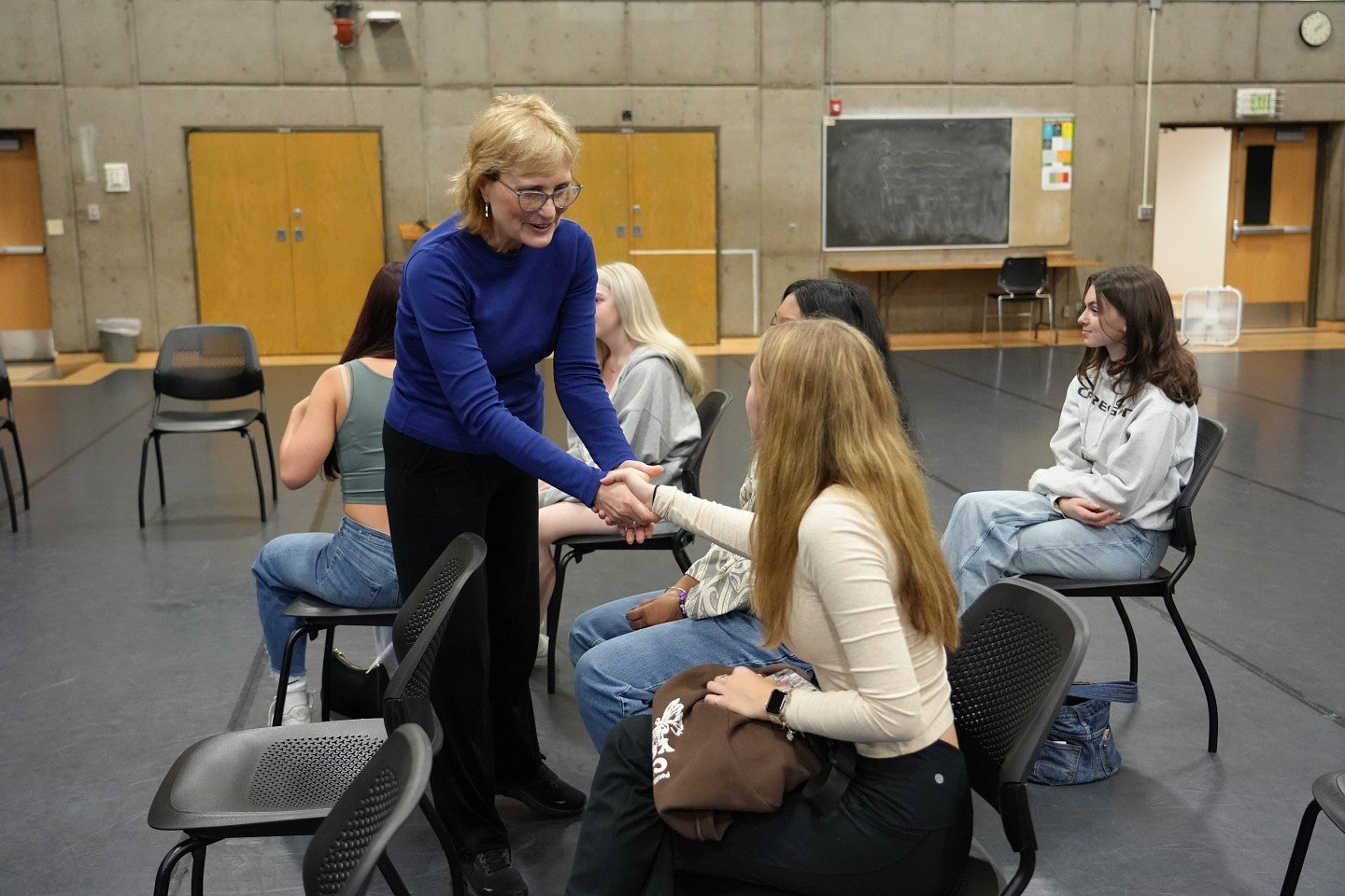 Patty Delaney greets incoming dance students at orientation