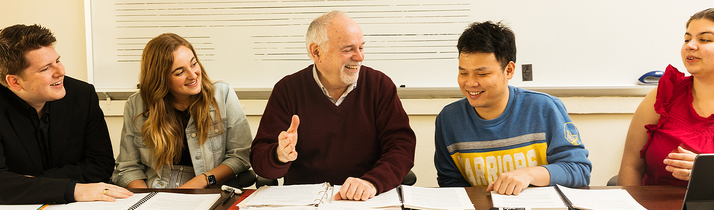 Group of Students with Faculty member smiling