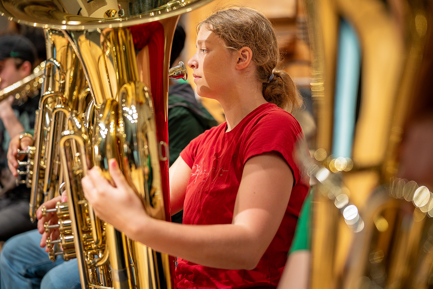 tuba student with instrument