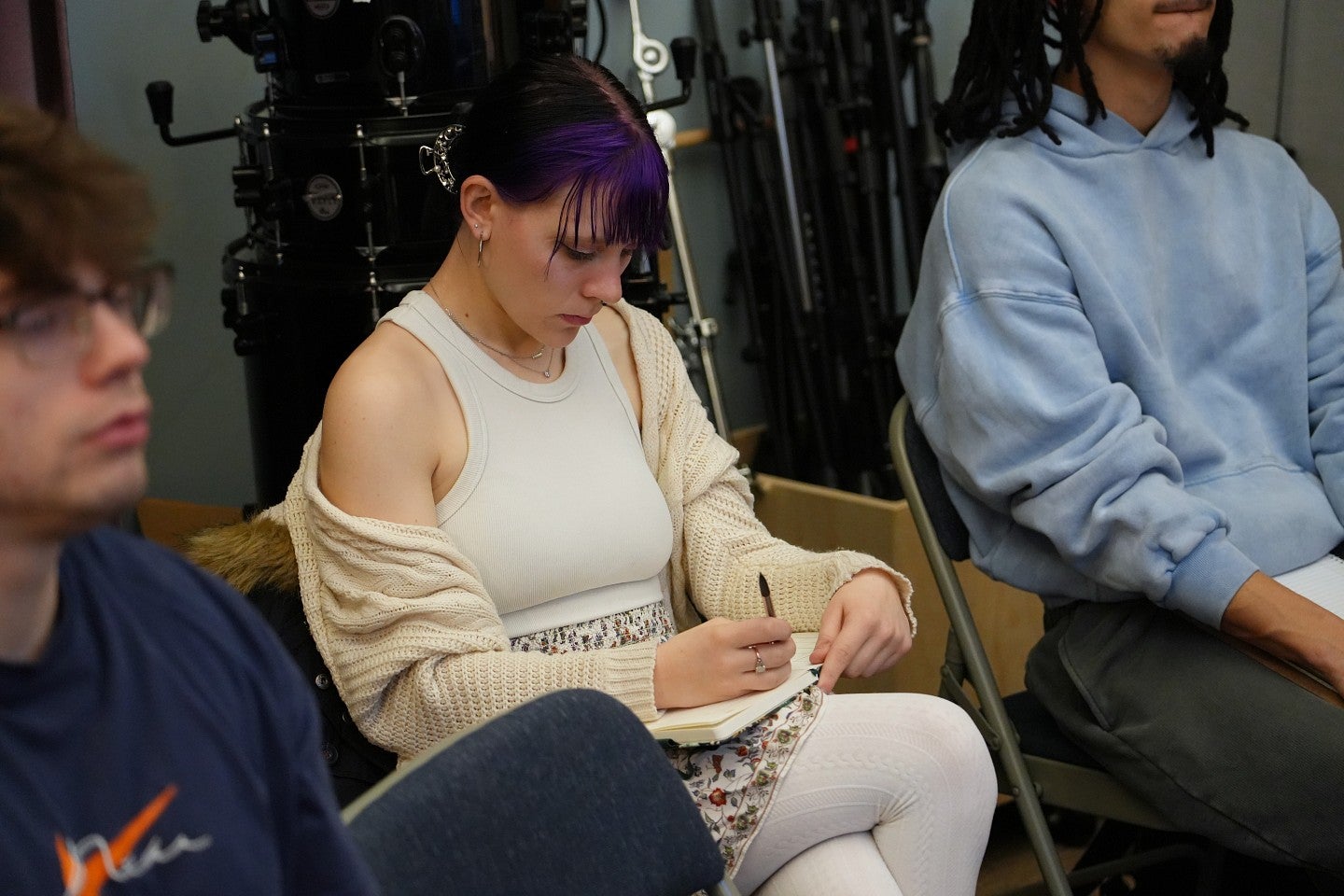 student taking notes