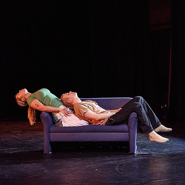 dancers leaning back on a couch