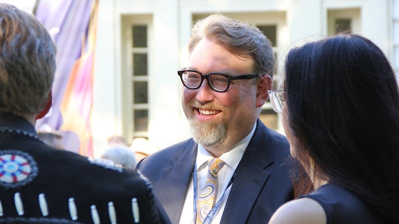 Boyd smiles alongside Kalapuya tribal elder