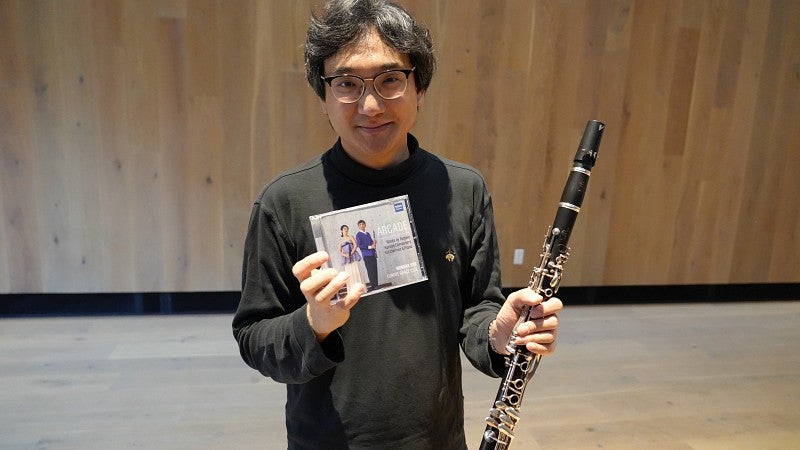 Wonkak Kim holding his newly released CD