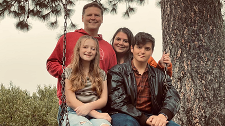 Jeff poses with his Amber, Camden, and daughter, Bella