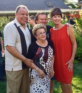 Anton Armstrong poses with Lilah, Brad, and Colleen Stangeland at a backyard SFYCA celebration
