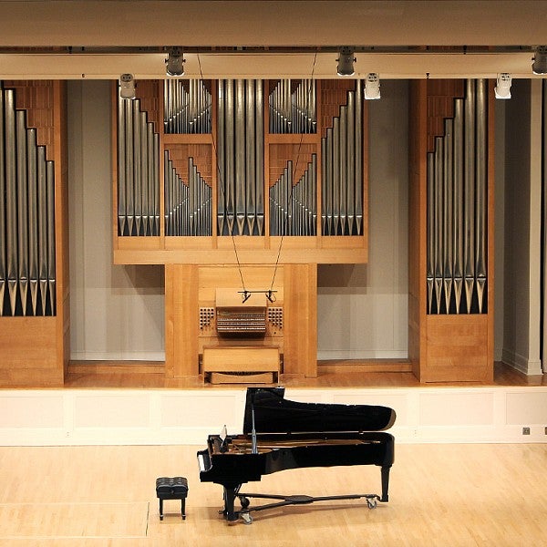 piano in the middle of beall concert hall