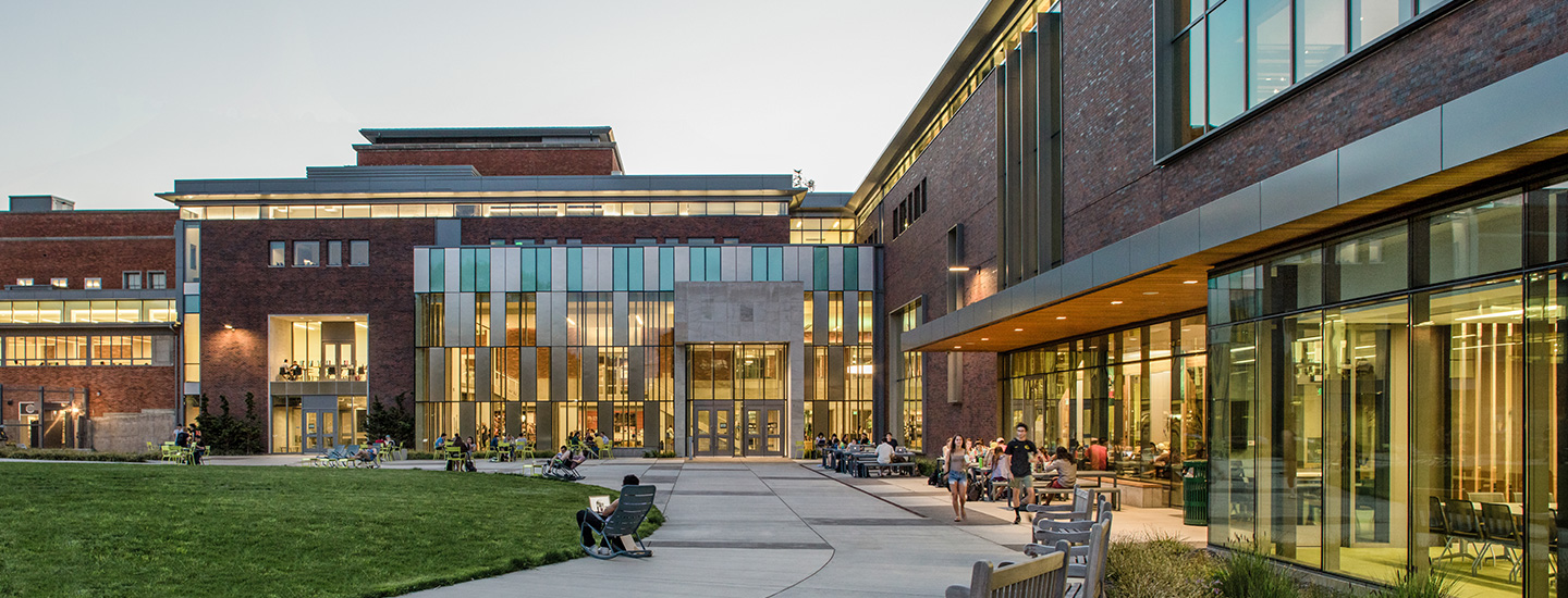 Rendering of EMU with students entering and exiting the building.