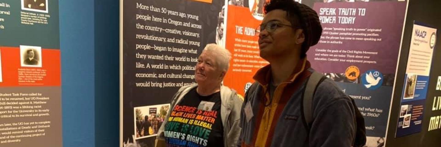 Two volunteers at a museum exhibit