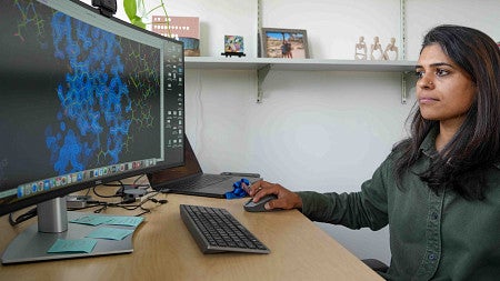 a person sitting looks at a computer screen with a visual displayed