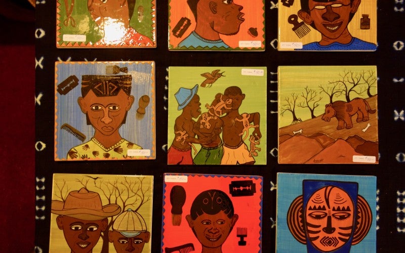 Four square art pieces depicting Malian stories and culture.