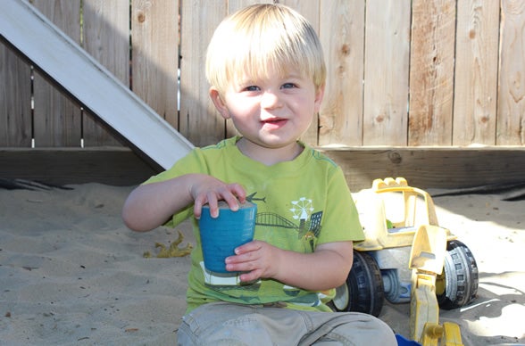 Child Playing in Sandbox