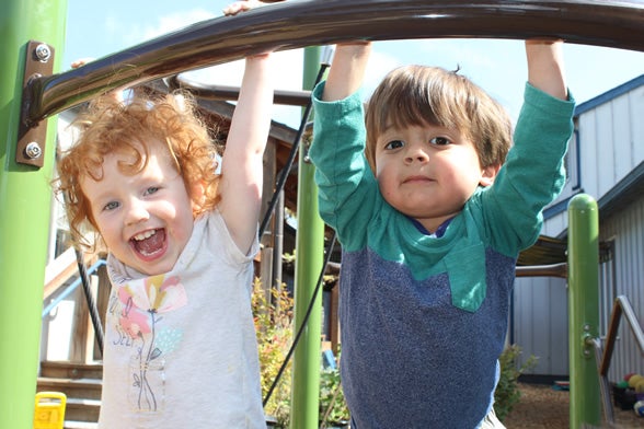 Smiling toddlers playing