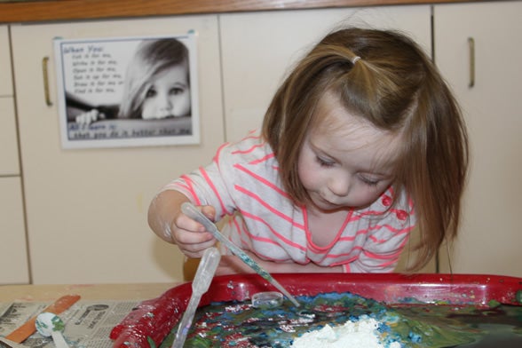 Preschool child experimenting