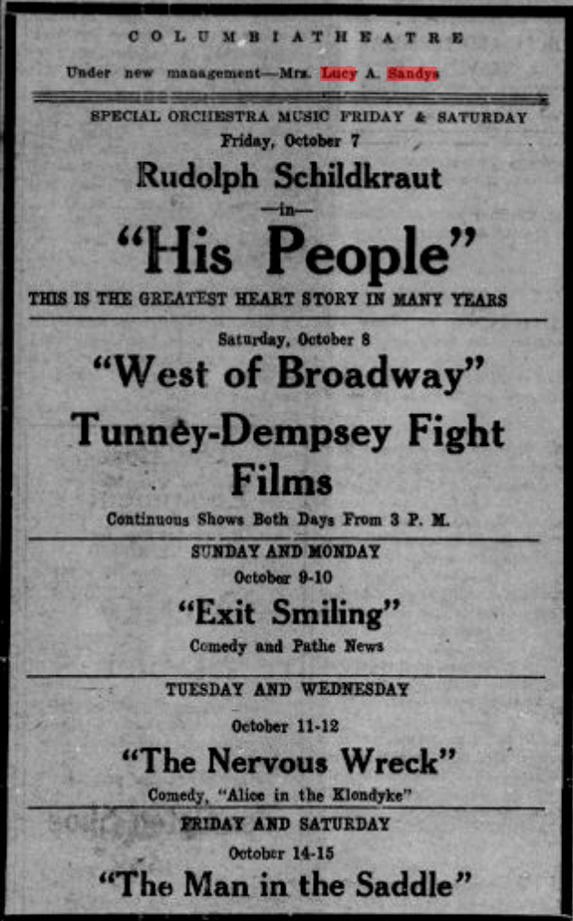 A black-and-white newspaper advertisement for the Columbia Theatre, announcing its new management under Mrs. Lucy A. Sandys. The ad lists upcoming screenings in October, including His People starring Rudolph Schildkraut on October 7, West of Broadway and Tunney-Dempsey Fight Films on October 8, Exit Smiling on October 9-10, The Nervous Wreck on October 11-12, and The Man in the Saddle on October 14-15. It also mentions special orchestra music on Friday and Saturday.