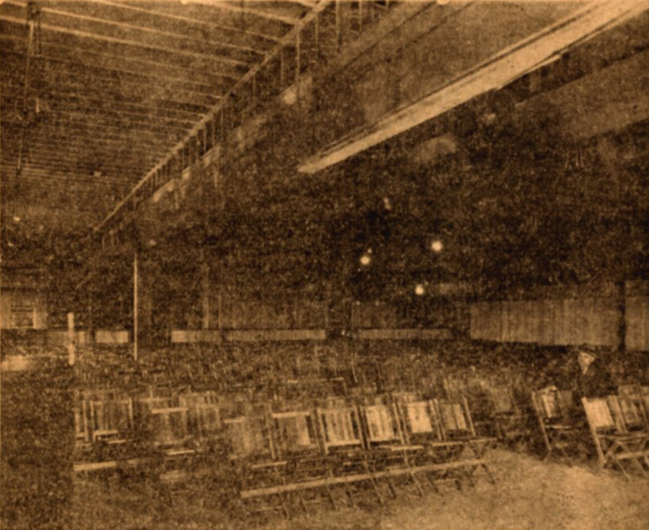 View of the temporary garage location at 14th and Exchange Streets and some of the key individuals who helped open the doors by Christmas 1922. Puget Sound Pipeline.