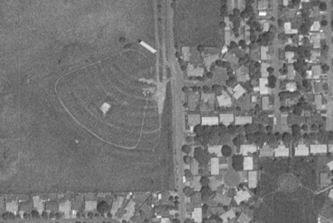A black-and-white satellite image of the closed Cascade Drive-In Theatre from 1994.
