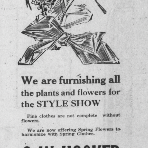 Newspaper ad for a florist referencing their location as across the corner from the Temple Theatre.