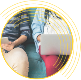 partial image of 2 children looking at a laptop