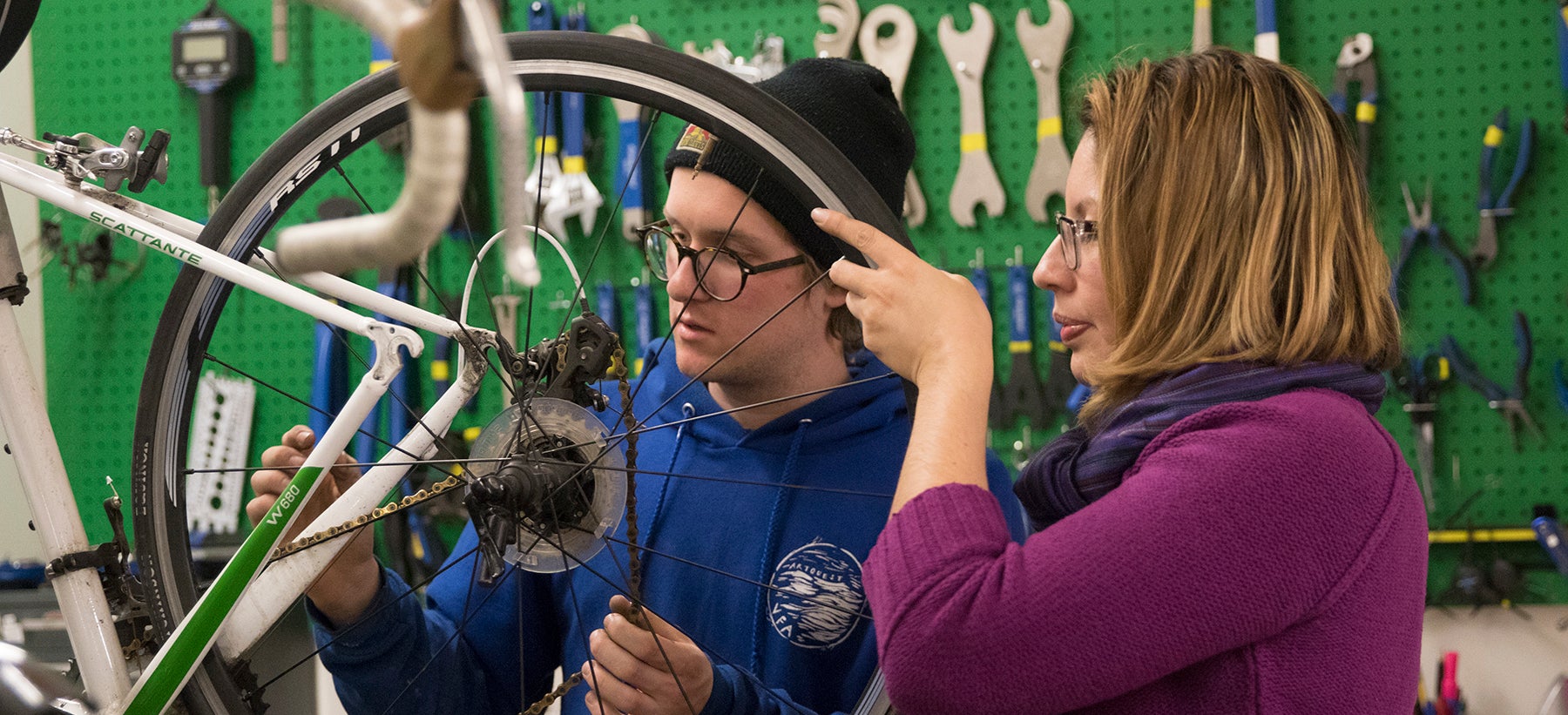 Staff demonstrating proper wheel maintenance.