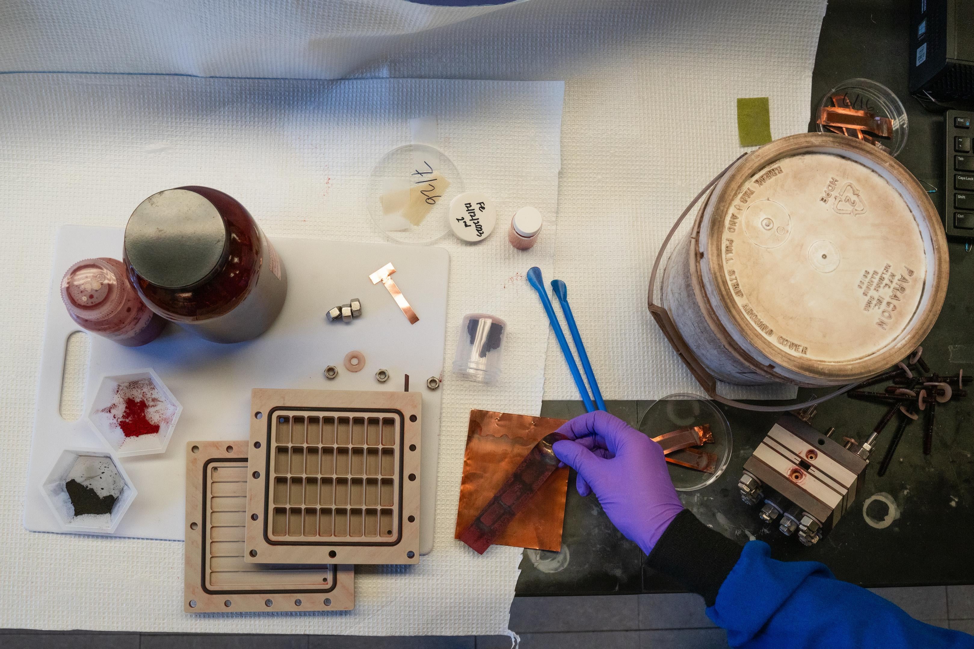 An overhead view of a lab bench containing supplies to harvest iron.
