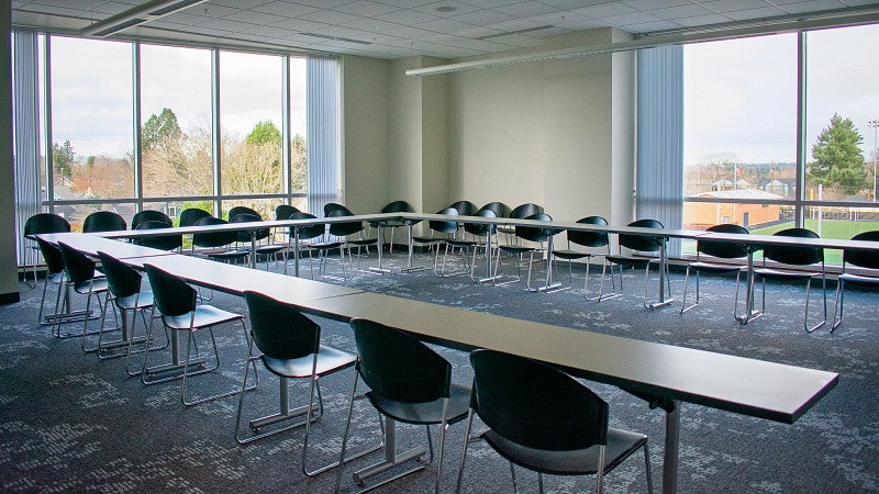 Classroom 303 tables are positioned in a U shape.