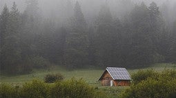 barn in misty field