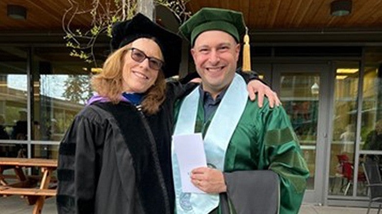 McKay Sohlberg, PhD with a student in regalia