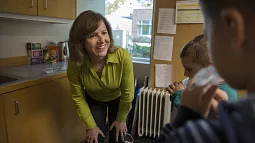 image of professor Leslie Leve with children