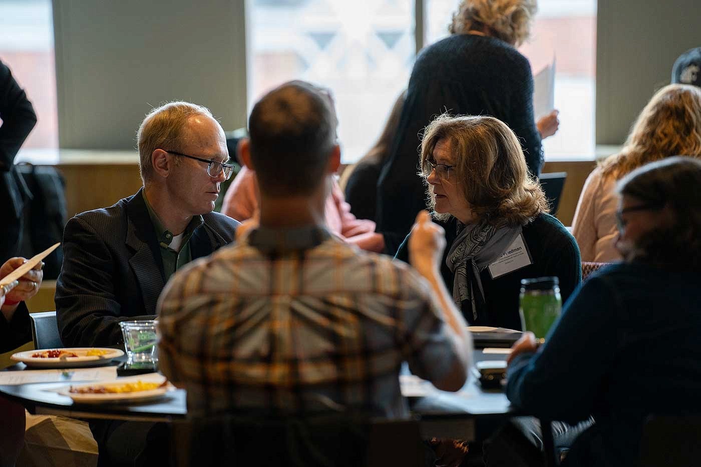 group of people in discussion at table