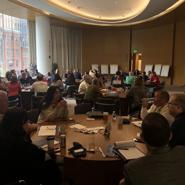 Group of people in discussion at a conference