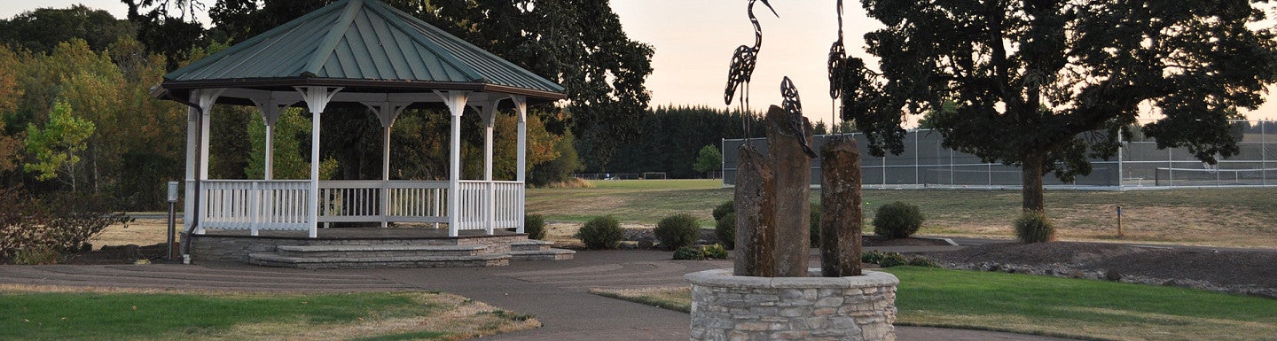 Park with gazebo and wire crane sculptures