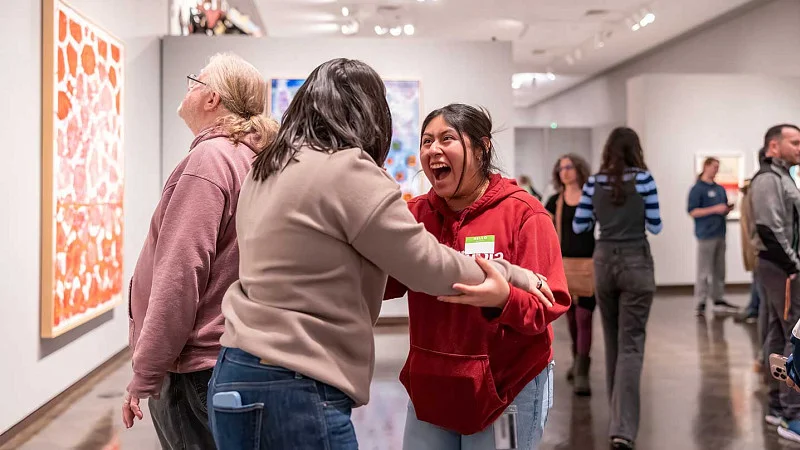Latinx students meet in the art gallery